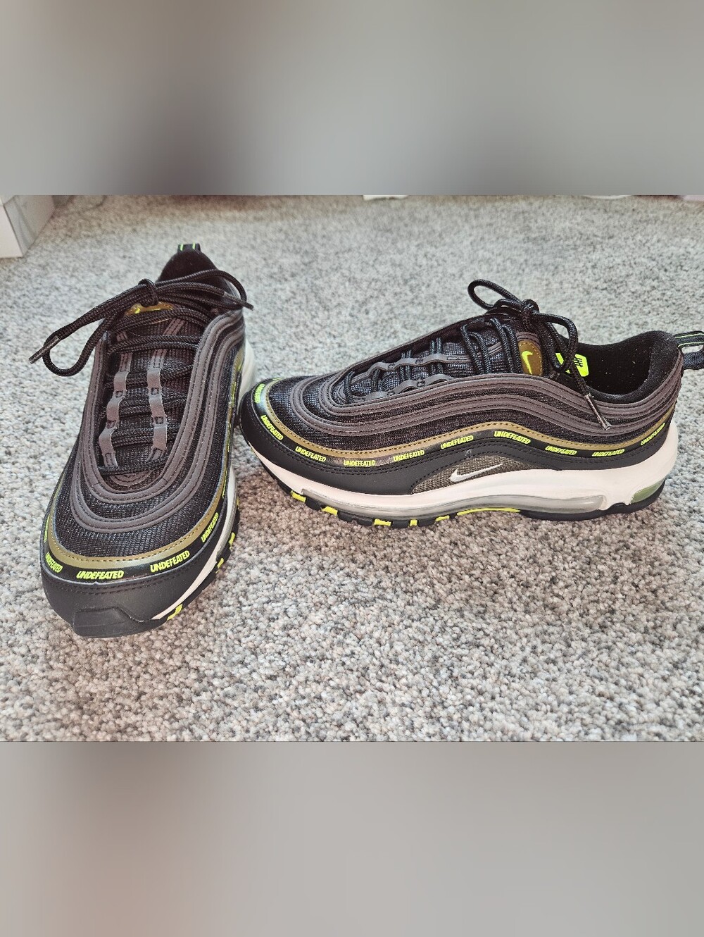 The Nike Air Max 97 Undefeated in Black Volt Size 7